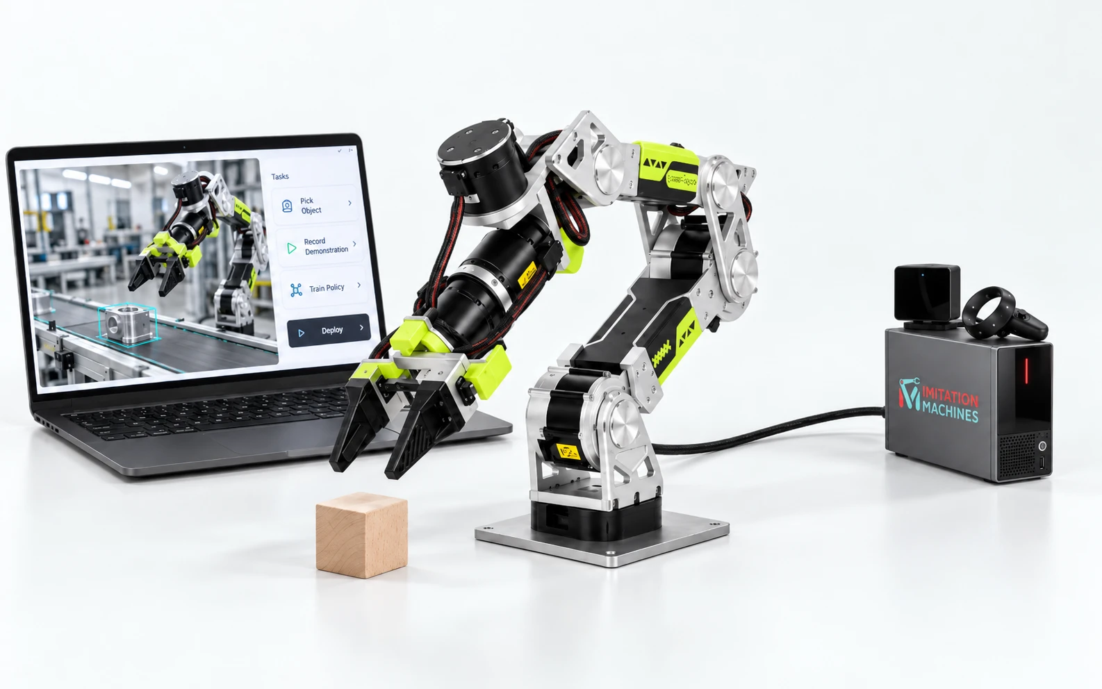 The Imitation Machines robot learning system: a reBot arm reaching for a wooden block, a compact compute tower with a VR base station and controller on top, and a laptop running Robot Learning Studio.